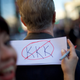 Lynette Byrnes writes an anti-Ku Klux Klan sign during a march of more than a thousand protesters toward Independence Hall against President-elect Donald Trump on Nov. 19, 2016, in Philadelphia.
Mark Makela/Getty Images
